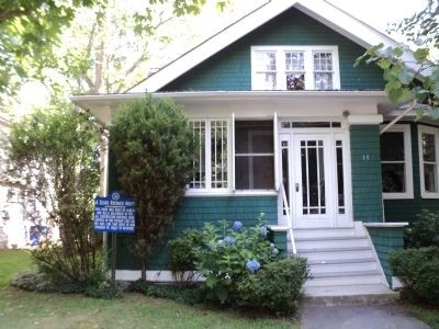 Photograph of the Sears Roebuck House and historical marker in front.