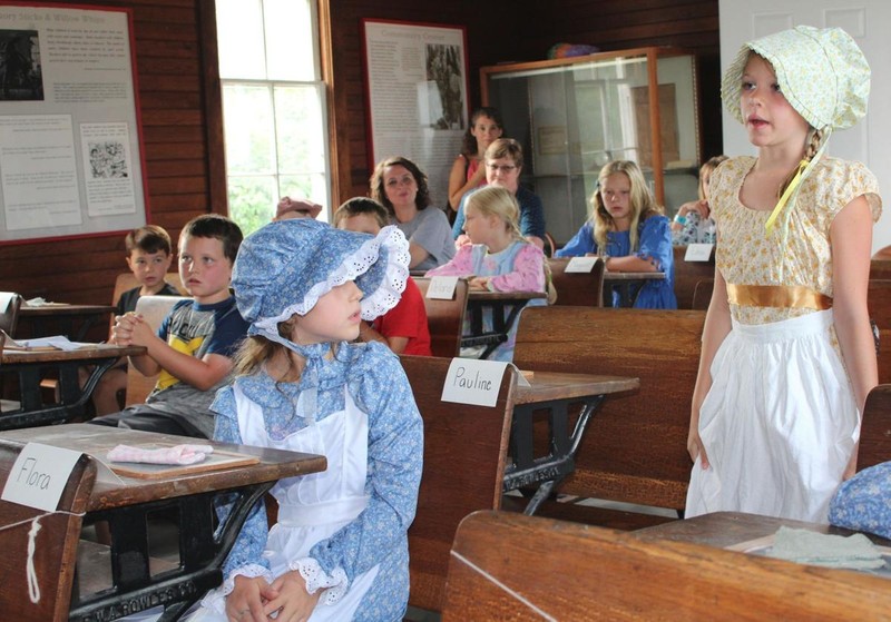 Student standing to answer teacher's question