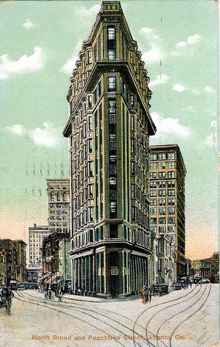 A historic postcard of the Flatiron Building