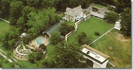 A birds eye view of the mansion showing the lavish design and pool.