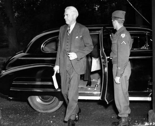 Clayton in 1945 arriving for the Potsdam Conference, at which the terms for the ending of WWII were negotiated