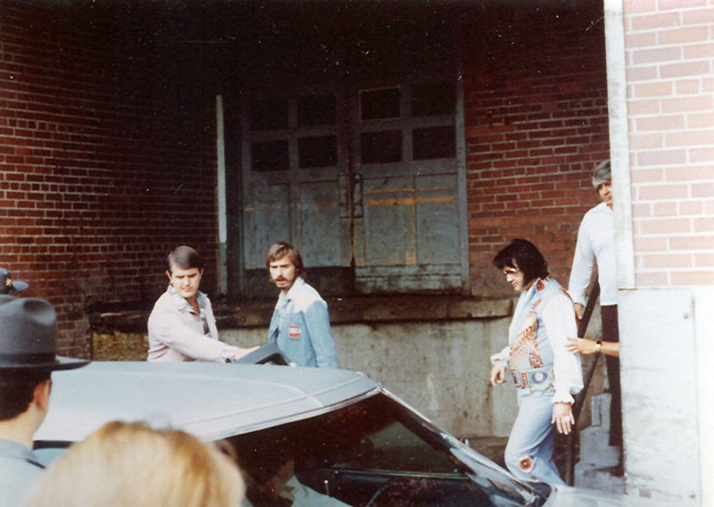 Elvis Presley exiting the Daniel Boone Hotel to perform a concert at the Charleston Civic Center on July 24, 1976.