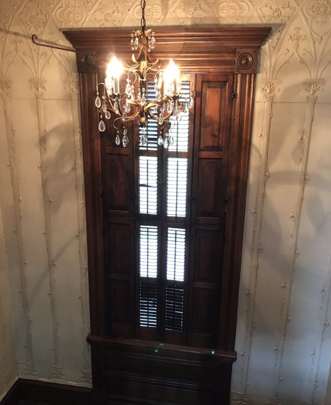 Original electric lighting fixture on stairs