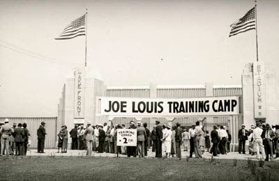 The banner on the stadium announcing the fighter's training in Kenosha.