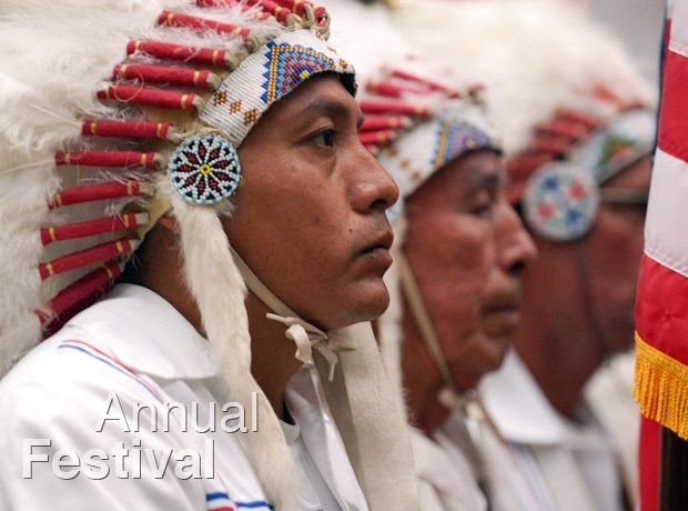 Picture of Native Americans in traditional clothing at the annual festival.