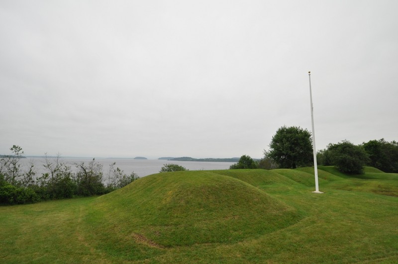 The remains of Fort Machias where canons were once located. The remains of Fort O'Brien are to the left and are obscured by bushes. The naval battle took place in the waters offshore.