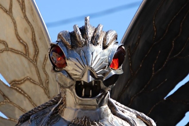 The face of the Mothman statue.