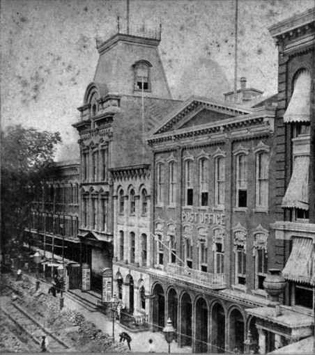 The theater prior to its destruction-the theater is the building with the large mansard roof to the left of the post office.