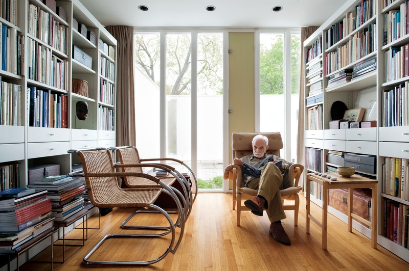 Philip Isaacson reading in his library. Photo Credit: Eric Roth