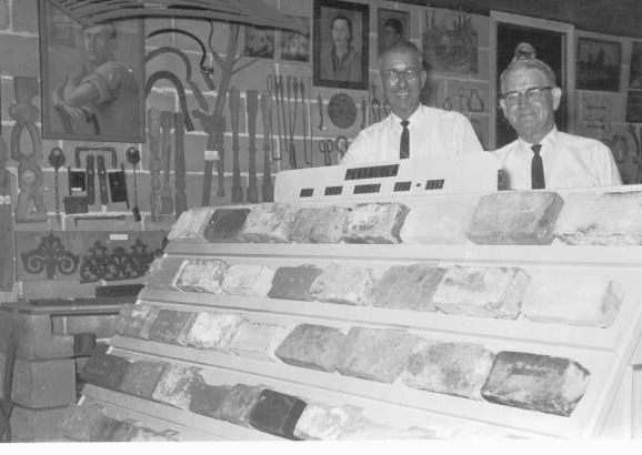 W.D. Donaldson and T. T. Wentworth Jr. standing with a brick collection which dated back to the 1600s at the museum.