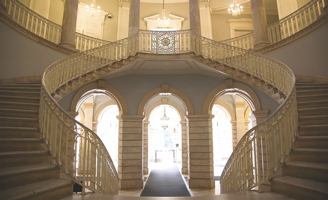 The grand staircase leading to the second floor.