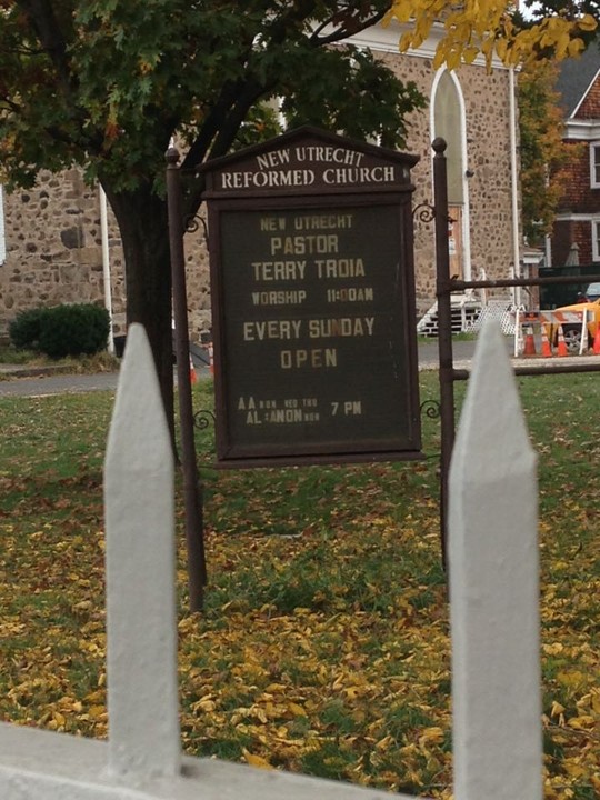 Sign in front of church -- Service days