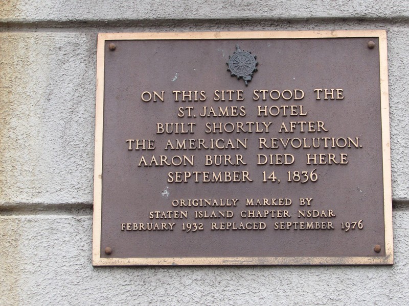 This is a plaque on the front of the apartment building that marks the old St. James Hotel and the death of Aaron Burr Jr.