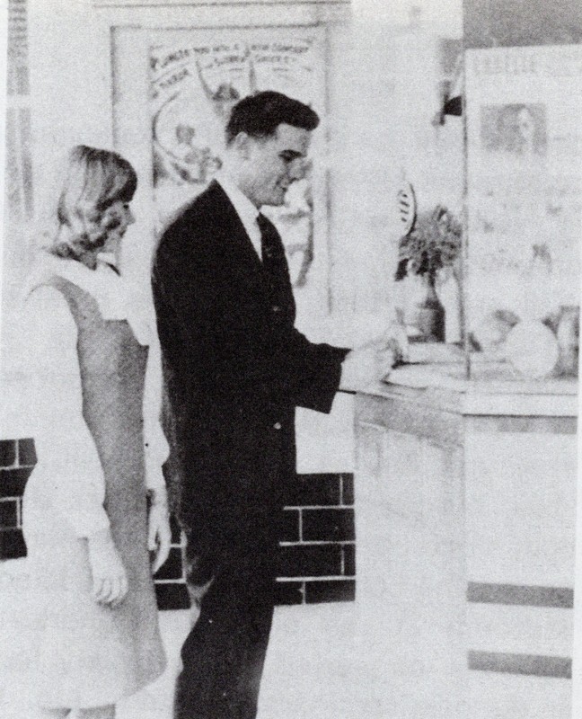 A couple purchases tickets at the LaBelle Theatre box office in 1964. Despite spending several decades as a church before being purchased by the city, the original box office remains.