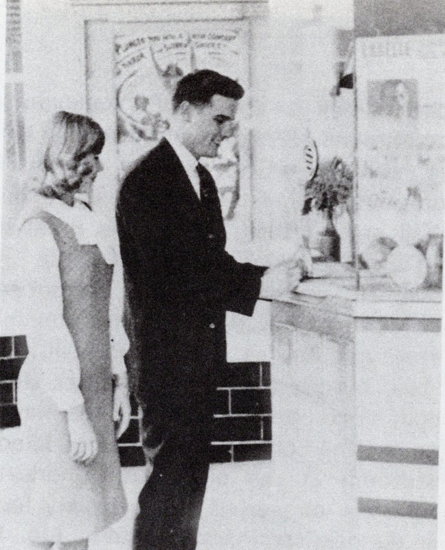 A couple purchases tickets at the LaBelle Theatre box office in 1964. Despite spending several decades as a church before being purchased by the city, the original box office remains. 