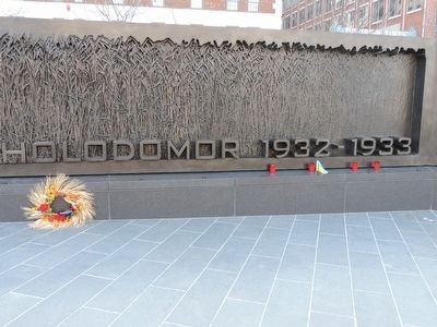 Signage on the Massachusetts Avenue side of the monument where visitors continue leaving flowers and icons in remembrance of those who died in the famine-genocides of the 1930s under Stalin.