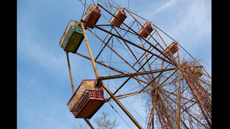 The rusted Ferris wheel is the most noticeable feature of the abandoned park. 