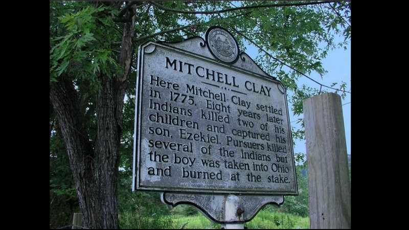 This sign provides a brief history of Mitchell Clay's family and the massacre of the two Clay children.