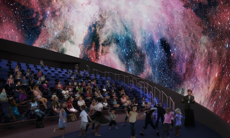 Students view a presentation in the Frost Planetarium.