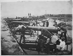 Members of the CSA Heavy Artillery man the fort's guns