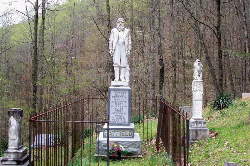 Erected in 1926, the marble statue of "Devil Anse" Hatfield remains the defining feature of the family cemetery. Image obtained from the Historical Marker Database.