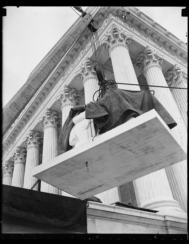 The first statue is placed outside the Supreme Court Building. Photo by Harris and Ewing, 1935, Library of Congress.