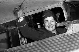 Helen Richey (1909-1947) smiling and waving out the plane window prior to beginning her flight with the United States commercial airline.