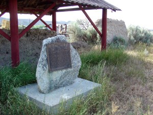 Historical Plaque adjacent to a remnant of an adobe wall