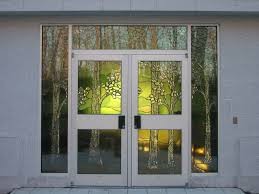 Front doors to temple. Stained glass images represent the Sacred Grove