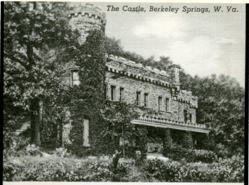 Photo ca. 1920-1930. The severely overgrown foliage suggests minimal maintenance and use of the building