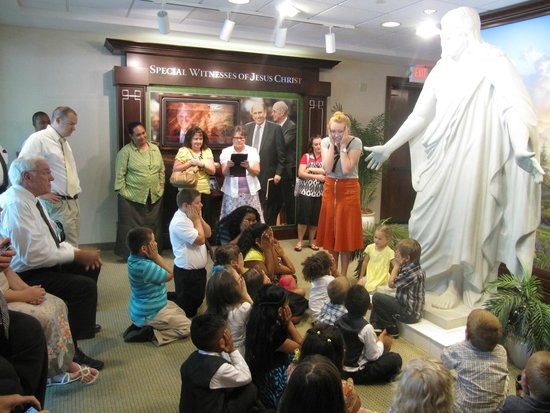 Missionaries assigned to visitor center teach kids about Christ.