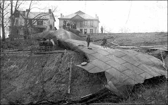 Children playing on the remains of one of the tanks.