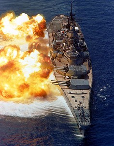 View of USS Iowa firing her main guns.  