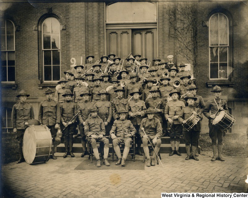 Land-grant institutions like WVU are required to train military officers. Here, members of the ROTC band pose for a portrait in front of Woodburn Hall. Photo circa 1915-1925.