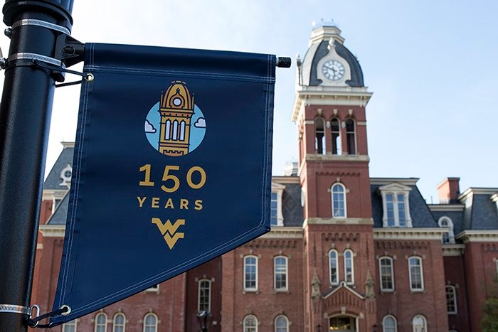 Woodburn Hall's iconic bell tower serves as the logo for celebrating WVU's 150th. Photo courtesy WV Metro News.