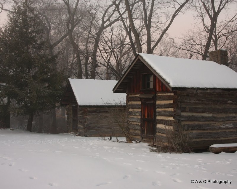 Historic log cabins in winter.