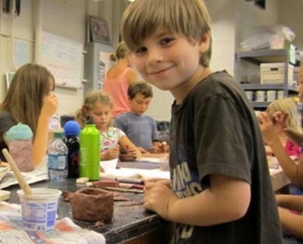 Student at a Baltimore Clayworks summer camp