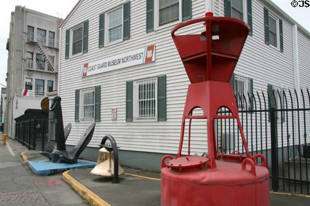 Exterior of the Coast Guard Museum with buoy in the foreground.