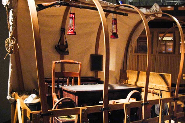 Covered wagon on display within the museum.