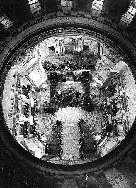 Mourners gather around the caskets of Mayor George Moscone and Supervisor Harvey Milk in City Hall (November 28, 1978)