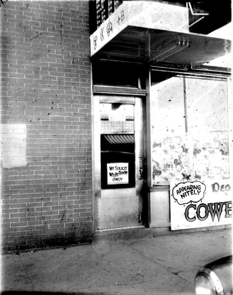 In 1954, the owner of the Cowboy Bar, located at the corner of South First and East Center, placed this "white trade only" sign on his window. Signs like this were rare in Pocatello, although more subtle forms of discrimination were common.