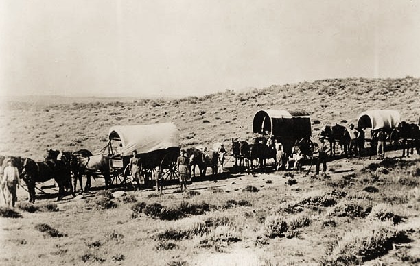 Wagon train of emigrants on the Oregon Trail