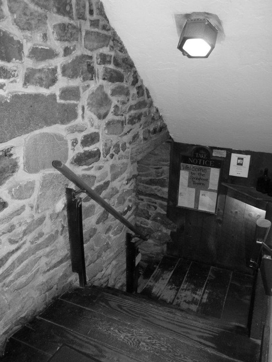 Original Colonial staircase leading to basement Tavern.