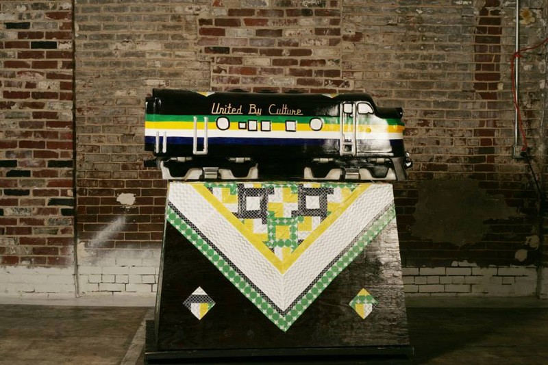 "United by Culture" was designed by Karen Frye who wanted to portray Appalachian identity through its relationship to quilting while including Marshall University and West Virginia University colors to depict the in-state university rivalry. (Photo c