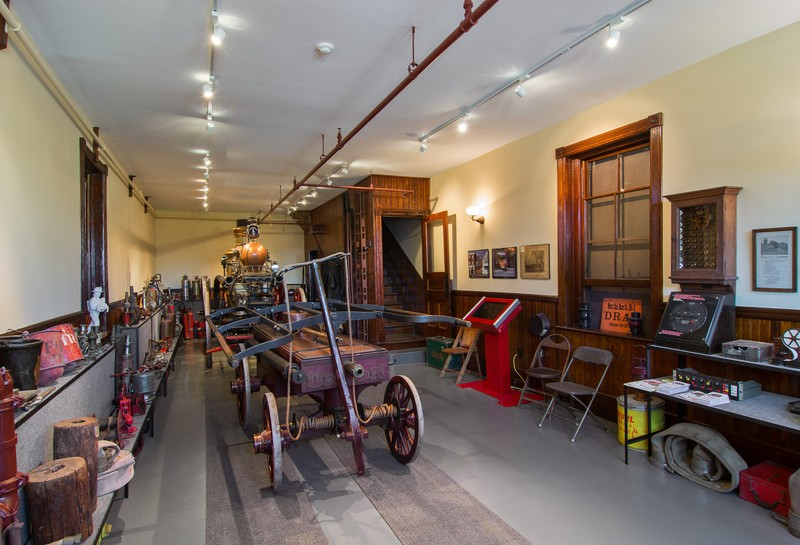 View inside the museum; the 1850 hand pump is in the foreground