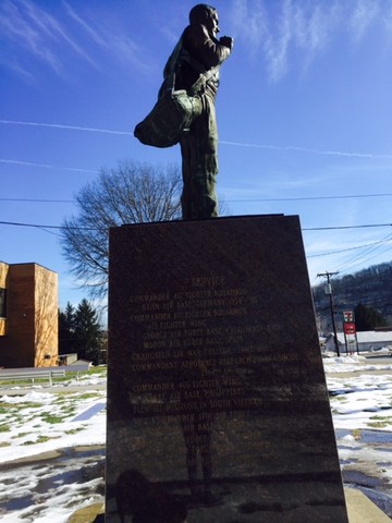 The left side of the statue which highlights Yeager's services. 