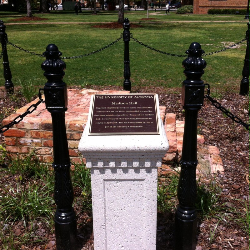 This is what Madison Hall looks like today. The bricks of the bottom left corner still remain, and are protected by a Black chain. The marker re-dedicated the remains to the university, which took place in 1875.