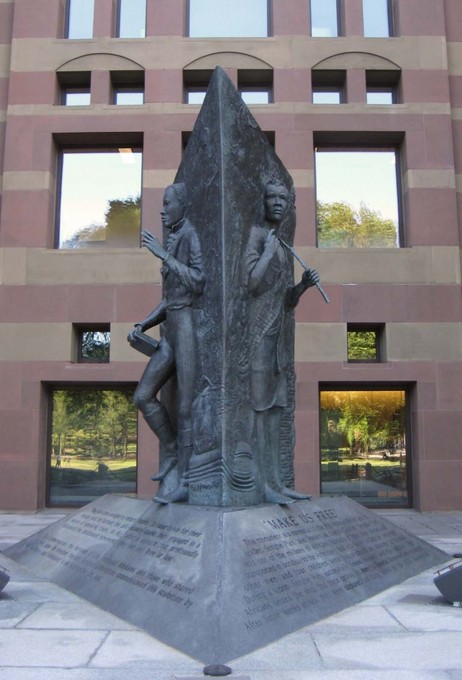 This monumnet was dedicated in 1992. This three-sided relief sculpture tells the story of Cinque’s journey from freedom in Sierra Leone, to his capture and trial in the Americas, to his return to freedom in Africa.