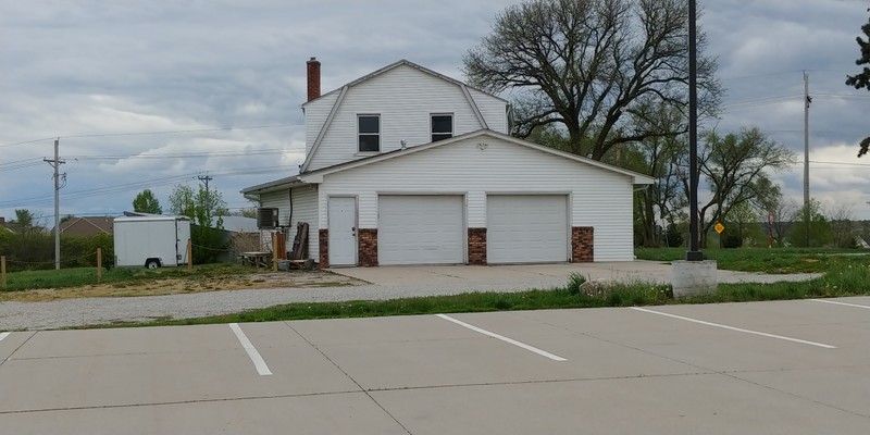 This house is located on the property but is not included as part of the Local Landmark. The garage is known as the "Man Cave" and is used by wedding parties for the groom and men to get ready. Photo taken May 6, 2020.