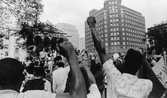 At a vigil on the New Haven Green Tuesday, Aug. 26, 1970 supporters raise their fists chant "Free Lonnie Mclucas". (AP Photo)